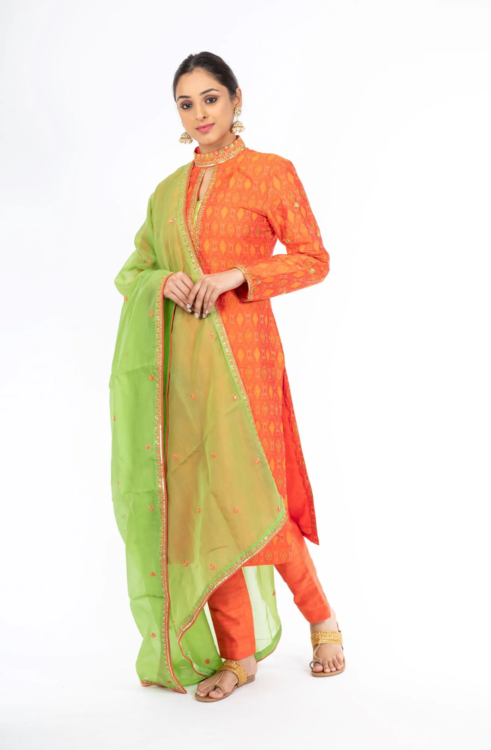 Alluring Mandarin Orange Raw Silk Ikkat Salwar Kameez