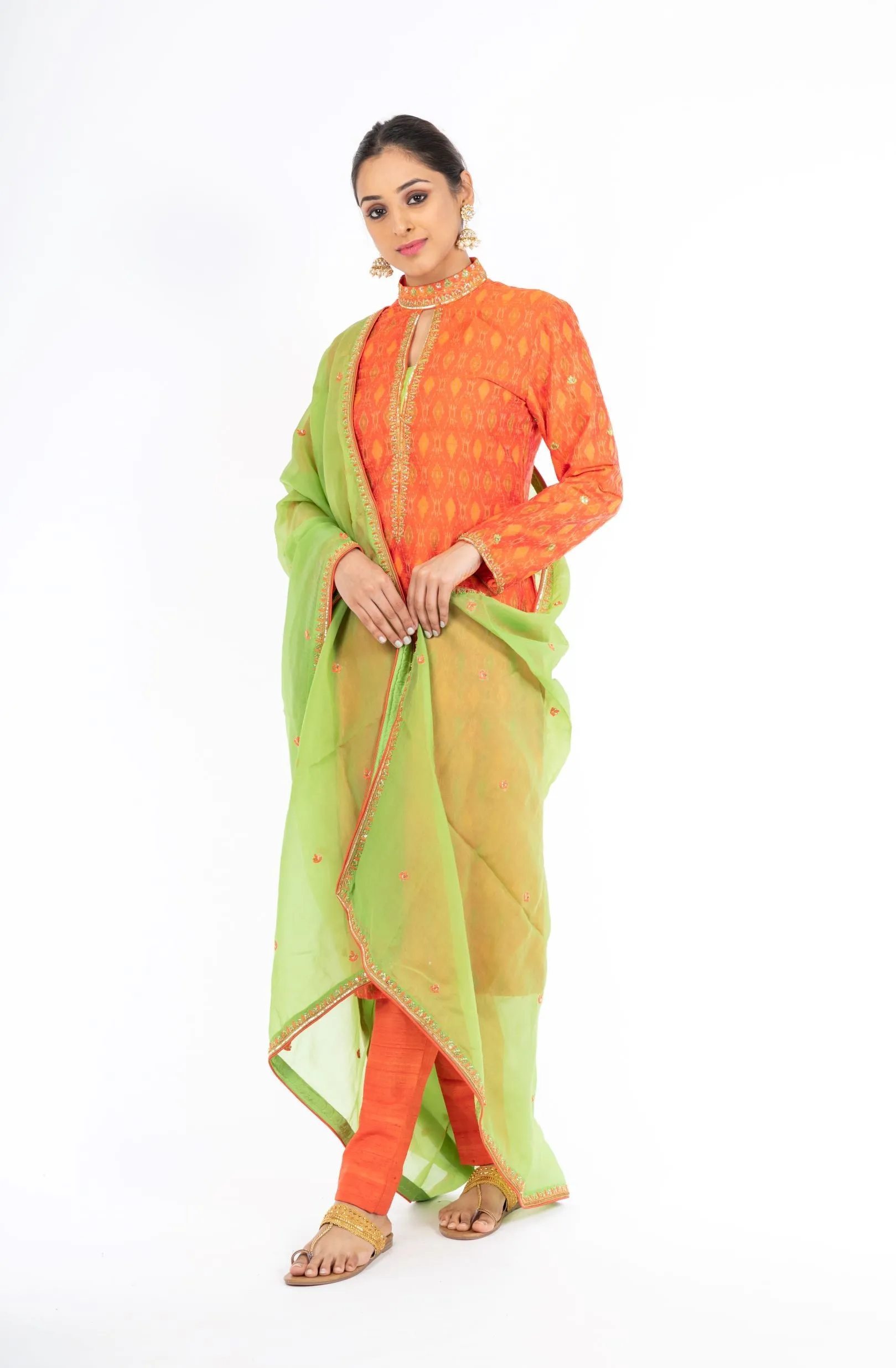 Alluring Mandarin Orange Raw Silk Ikkat Salwar Kameez